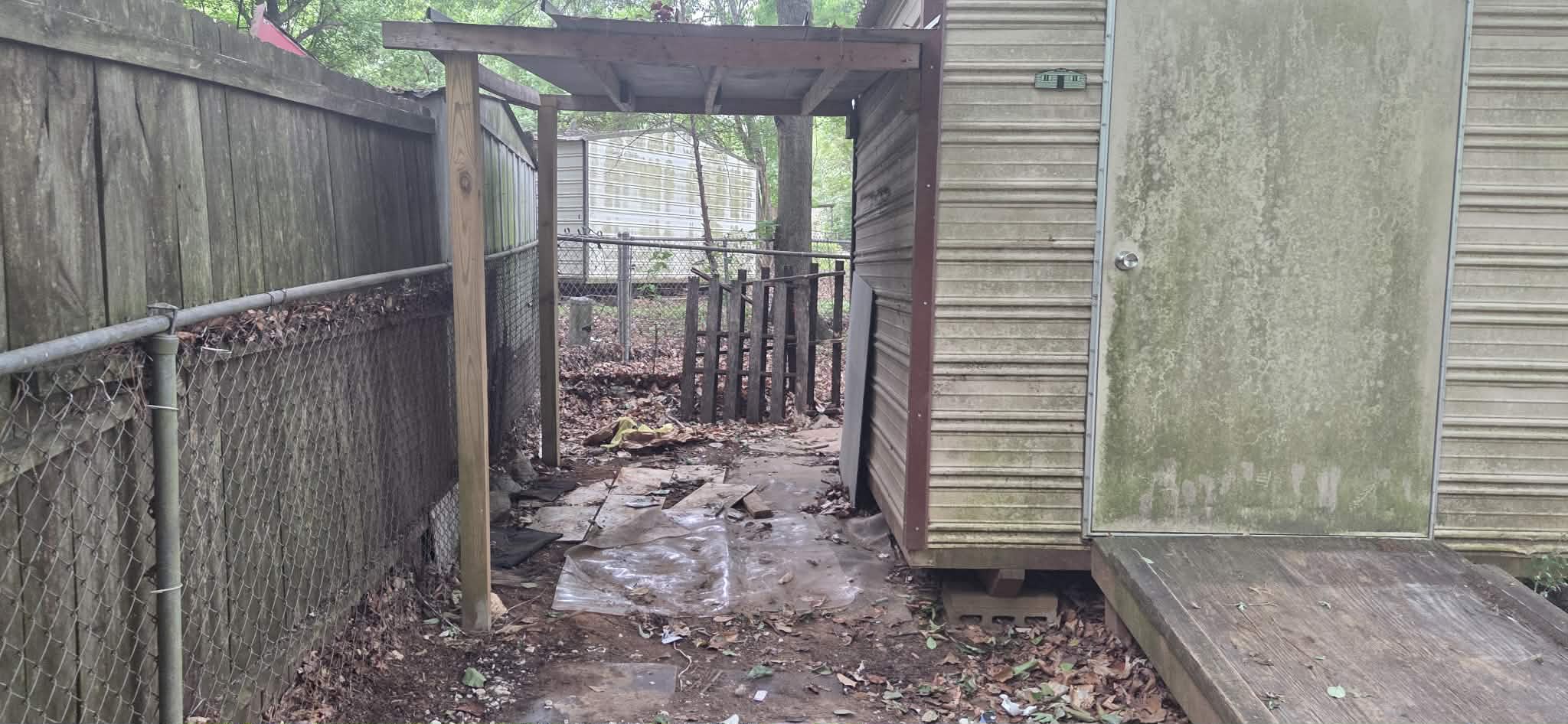 Clean backyard after debris removal in Columbus GA — all junk and wood scraps hauled away