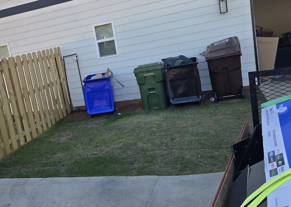 Clean curb area after junk removal in Midland GA — all cardboard and junk hauled away